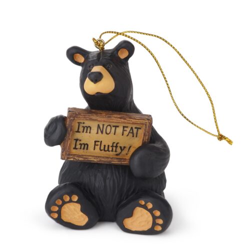 A cute black bear figurine holding a sign that says 'I'm NOT FAT I'm Fluffy'.