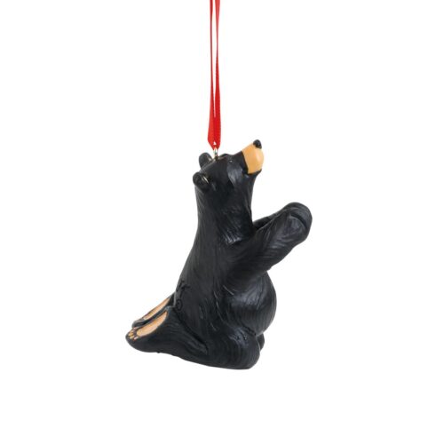 Black bear ornament hanging by a red string.