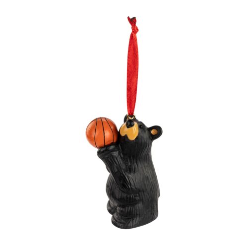Black bear ornament holding a basketball, hanging by a red ribbon.
