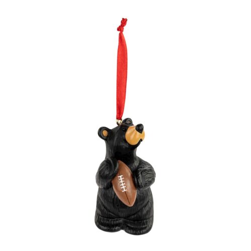 Black bear ornament holding a football with a red hanging ribbon.