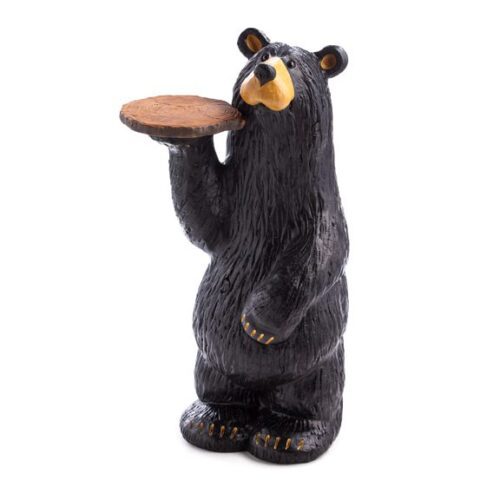 A black bear figurine holding a round wooden tray.