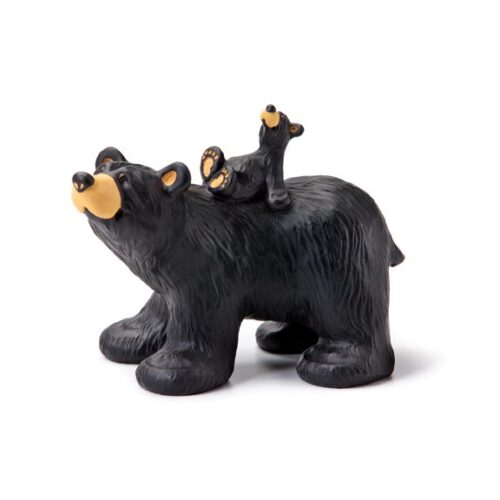 A black bear figurine with two cubs on its back.