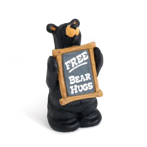 A black bear figurine holding a 'Free Bear Hugs' sign.