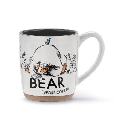 A humorous coffee mug with a bear illustration and text.