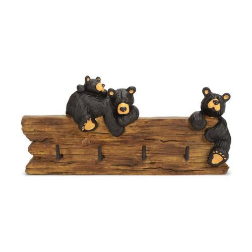 Wooden bear figurines on a carved log.