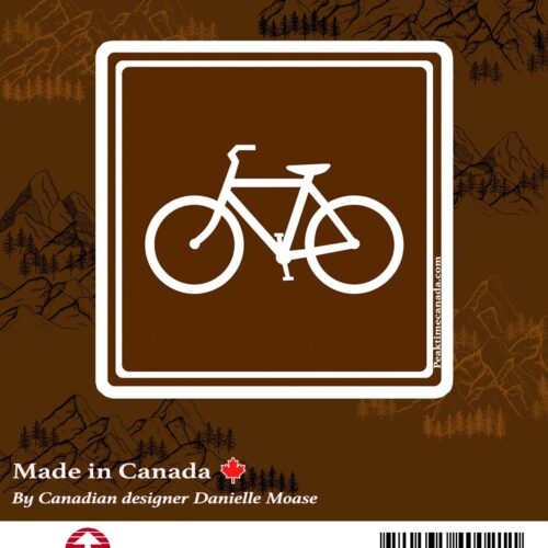 White bicycle symbol on a brown sign indicating a bike route or bike-friendly area.