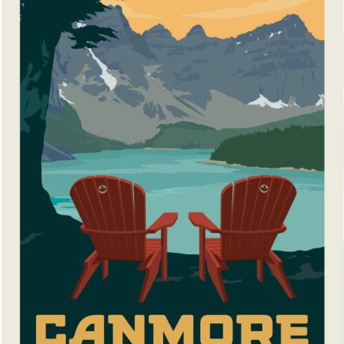 Two chairs overlooking a lake with mountains during sunset in Canmore.