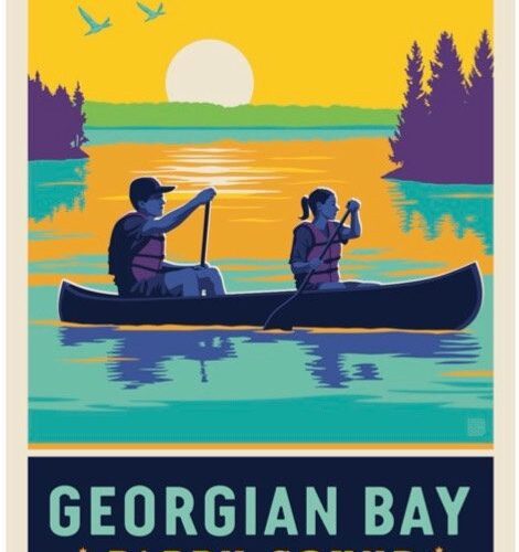 Two people canoeing on Georgian Bay at sunset.