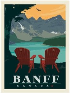 Two red chairs overlooking a serene mountain lake in Banff.