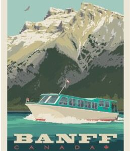 Boat cruising near snowy mountain peaks at Banff.