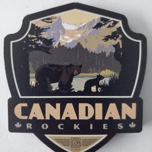 A logo featuring a bear in a mountainous Canadian Rockies landscape.