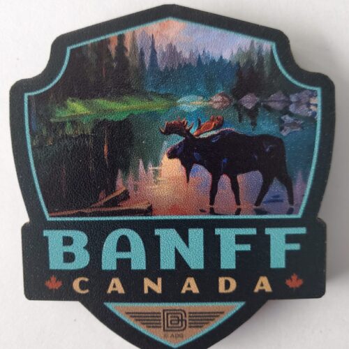 Scenic Banff Canada emblem with moose silhouette at sunset.