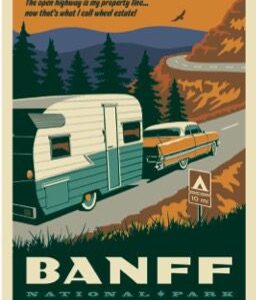 Retro trailer and car driving through Banff's scenic mountain road.
