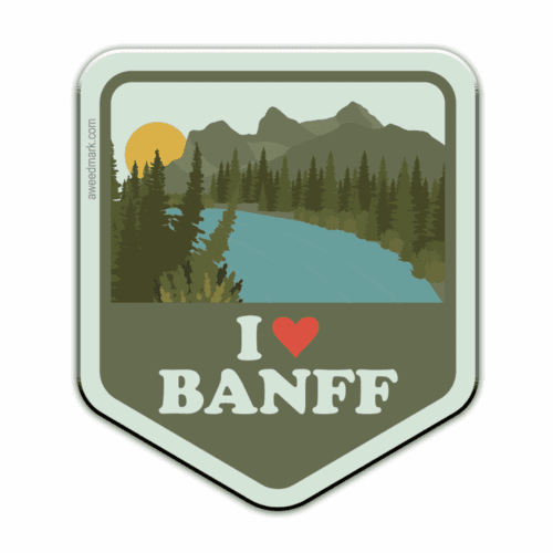 A badge featuring a scenic Banff landscape with trees and mountains.