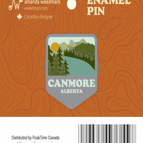 Canmore Alberta enamel pin with mountain and forest design.
