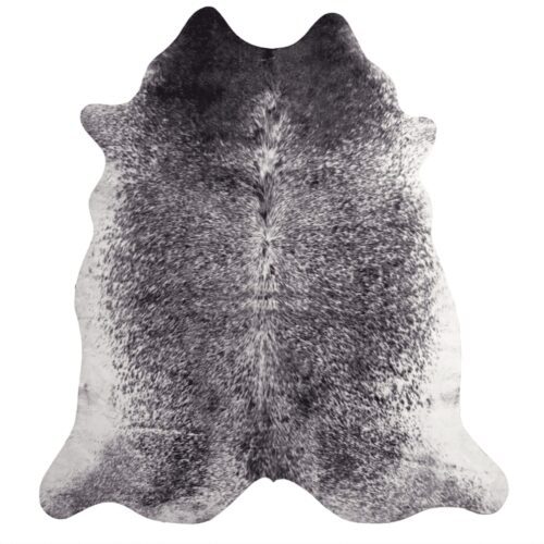 Black and white cowhide rug with a natural shape.